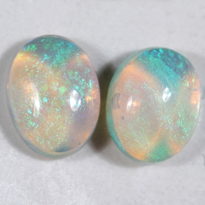 SOLID CRYSTAL OPALS Matching pair, 3D pattern. Bright green fire throughout